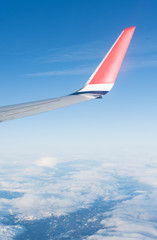 Wing aircraft in blue clear sky during flight