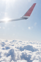 Fototapeta na wymiar Wing aircraft in blue clear sky during flight