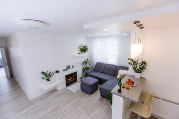 Interior design with couch, colorful cushions and lamp