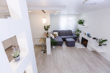 Modern living room and kitchen in small apartment