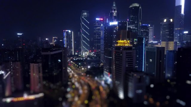 nigh time illuminated guangzhou downtown traffic road aerial panorama tilt-shift 4k china