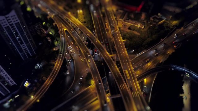 night time illuminated guangzhou traffic road junction aerial panorama tilt-shift 4k china