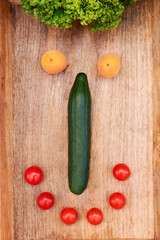 Happy and smiling face made by fresh vegetables and fruits as a idea concept for healthy nutrition. Healthy food for vegetarian. 