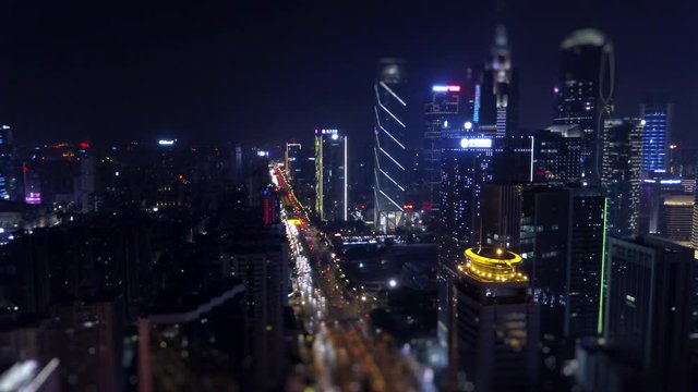 night time illuminated guangzhou traffic road junction aerial panorama tilt-shift 4k china