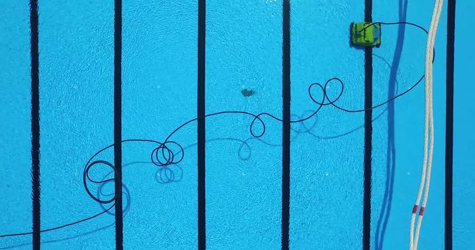 Handheld shot of cleaner cleaning swimming pool, Leonberg, Germany