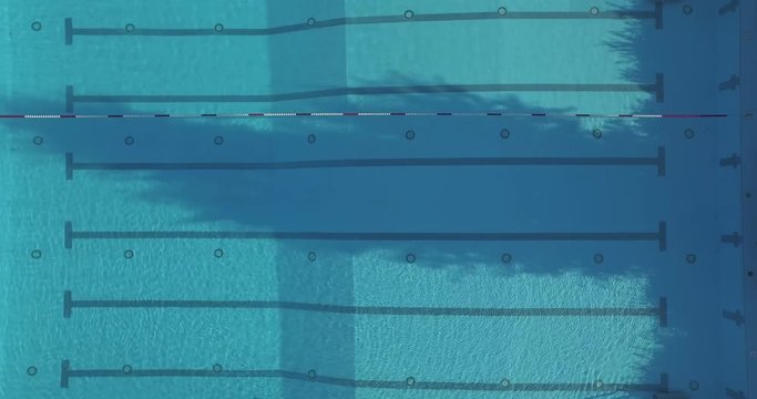 Lockdown shot of shirtless man swimming in pool, Sindelfingen, Baden-Wuerttemberg, Germany