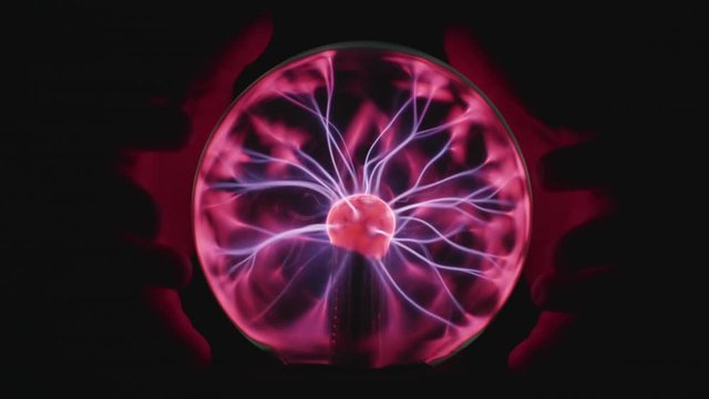 Magician hands with Plasma Ball - attempting to control the elements