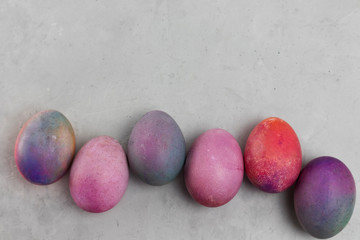 Easter eggs in a row on a light background
