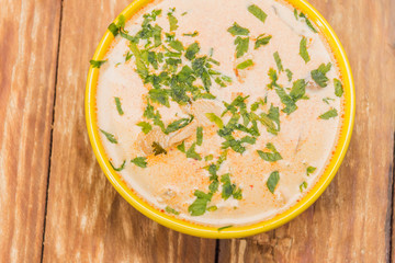 Delicious gold yellow asian soup for a good meal.
