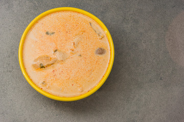 Delicious gold yellow asian soup for a good meal.