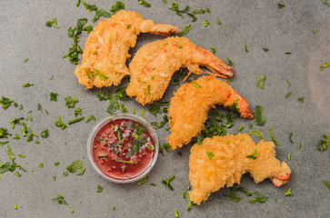 Delicious crispy gold yellow fried shrimp with a nice crust for a good meal.