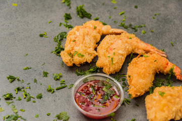 Delicious crispy gold yellow fried shrimp with a nice crust for a good meal.