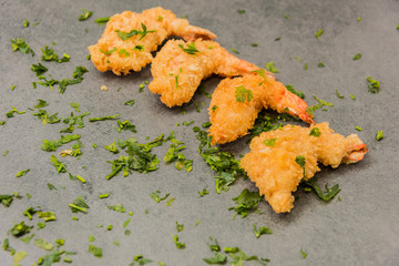 Delicious crispy gold yellow fried shrimp with a nice crust for a good meal.