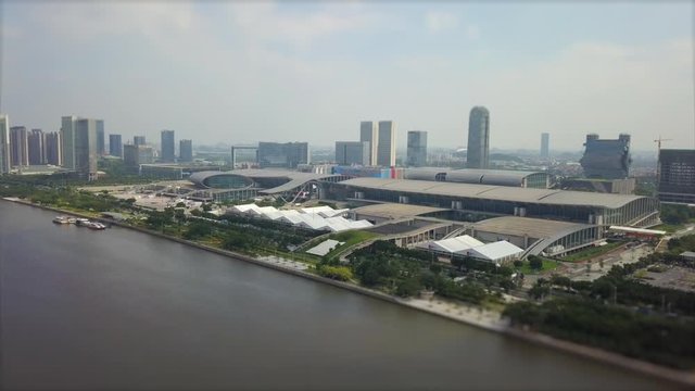 guangzhou convention and exhibition centre pearl riverside day time aerial panorama tilt-shift 4k china