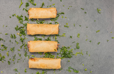 Delicious crispy gold yellow spring rolls for a good meal.