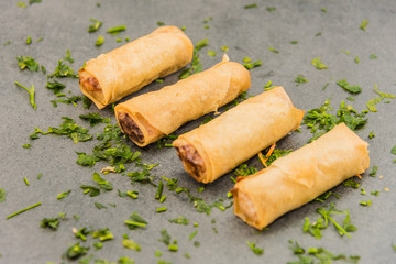 Delicious crispy gold yellow spring rolls for a good meal.