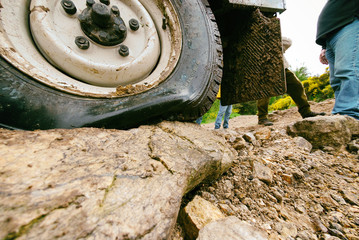 close-up at off-road car's flat tire.