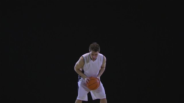 SLO MO, WS, Lockdown, basketball player dribbling and shooting a basketball 