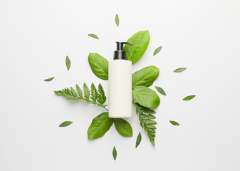 Cosmetic product in bottle on white background