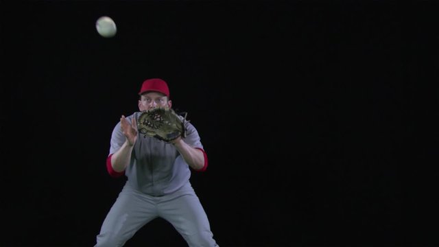 SLO MO, MS, Lockdown baseball player catching a ball and throwing it