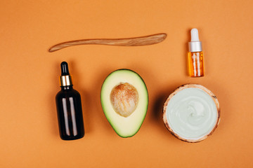 Modern accessories and herbal cosmetics for natural face care. Flat lay style.