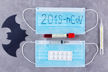 Coronavirus - 2019-nCoV. Test tube with blood identified by the 2019-nCoV coronavirus on gray...