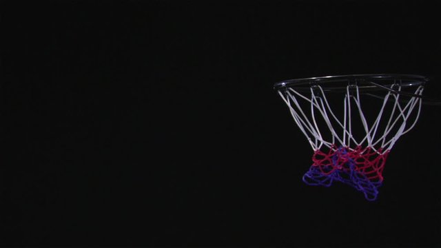 SLO MO, CU, Lockdown basketball player dunking a basketball into a basketball hoop