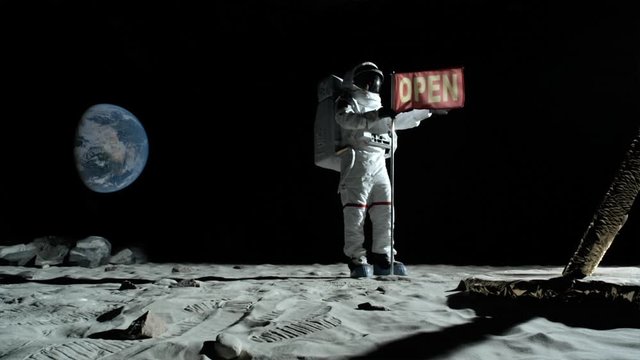 SLO MO, WS, Lockdown of an astronaut putting up an OPEN flag on the moon