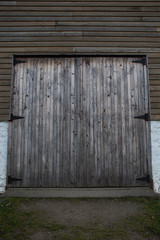 weathered wooden doors of a barn