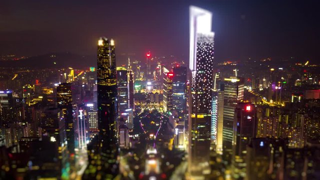 night time illuminated guangzhou downtown cityscape aerial tilt shift panorama 4k timelapse china