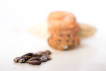 Watermelon seeds, with several seeds in the background and later on the white background.