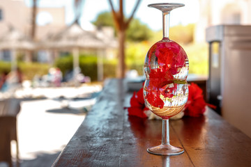 Rose petals in a wine glass