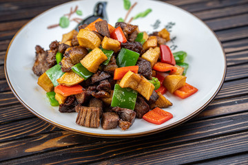 Beef stew with potatoes in a plate.