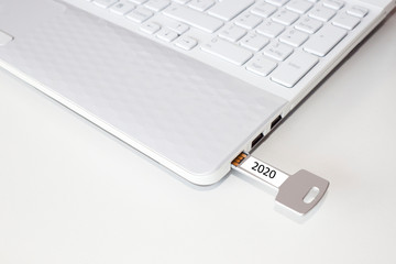 key pendrive in the usb port of a laptop