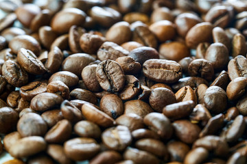brown coffee grains close-up with blurry background