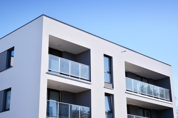 Contemporary residential building exterior in the daylight. Modern and new apartment building. 