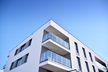 Contemporary residential building exterior in the daylight. Modern and new apartment building. 