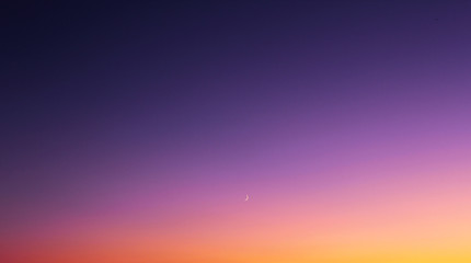 Magenta sky sunset, waxing moon in East Sussex, England.. Concept of romance, youth, dreams
