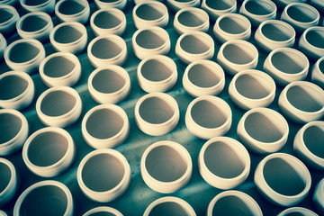 Filtered image group of raw unbaked clay terra cotta pots full background in Hanoi, Vietnam