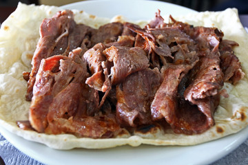Turkish Doner Kebab with pita in dinner plate