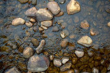 Fototapeta na wymiar Top view photography of river rocks captured at the El Valle river in the south of the department of Santander in Colombia