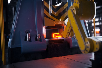 Fototapeta premium Hot metal billet under the press.