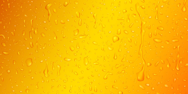 Background with drops and streaks of water in yellow colors, flowing down the surface