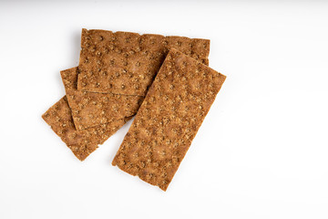 Grain diet light crisp bread lying on a white background