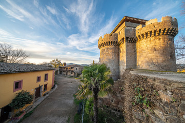 Fototapeta premium A medieval age scenery at the amazing and abandoned Granadilla town. The impressive medieval castle with it tower in between the surrounding defense wall is an awe representation of the human history 