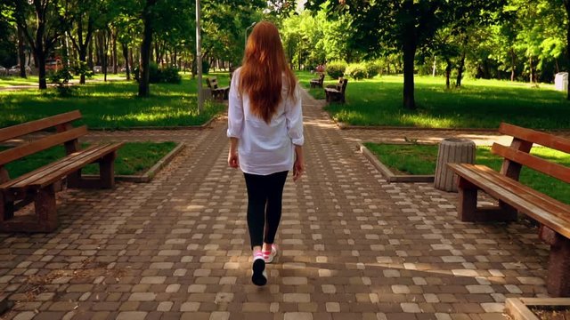 happy lifestyle young woman walk in park slow motion summer landscape