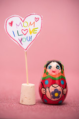 happy Motherday card, pink  background, sign written with children`s handwriting  and babuschka
