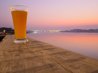 glass of beer on sunset time.