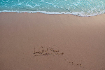  On the sand, there was a letter saying love
