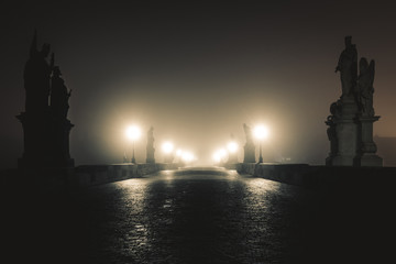Fototapeta na wymiar View of the Charles Bridge in Prague on Misty Night